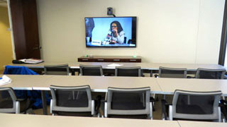 Conference Room E classroom style with video conferencing